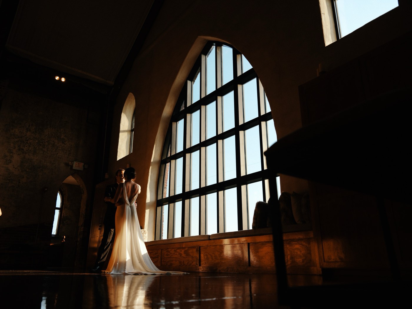 Reception tables and candlelit wedding details inside a Wilmington venue.